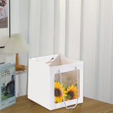 Elegant White Paper Bags lined up on a store counter, ready for customer purchases.