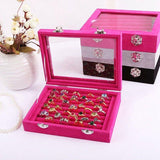 Elegant ring display box with clear glass lid and velvet interior