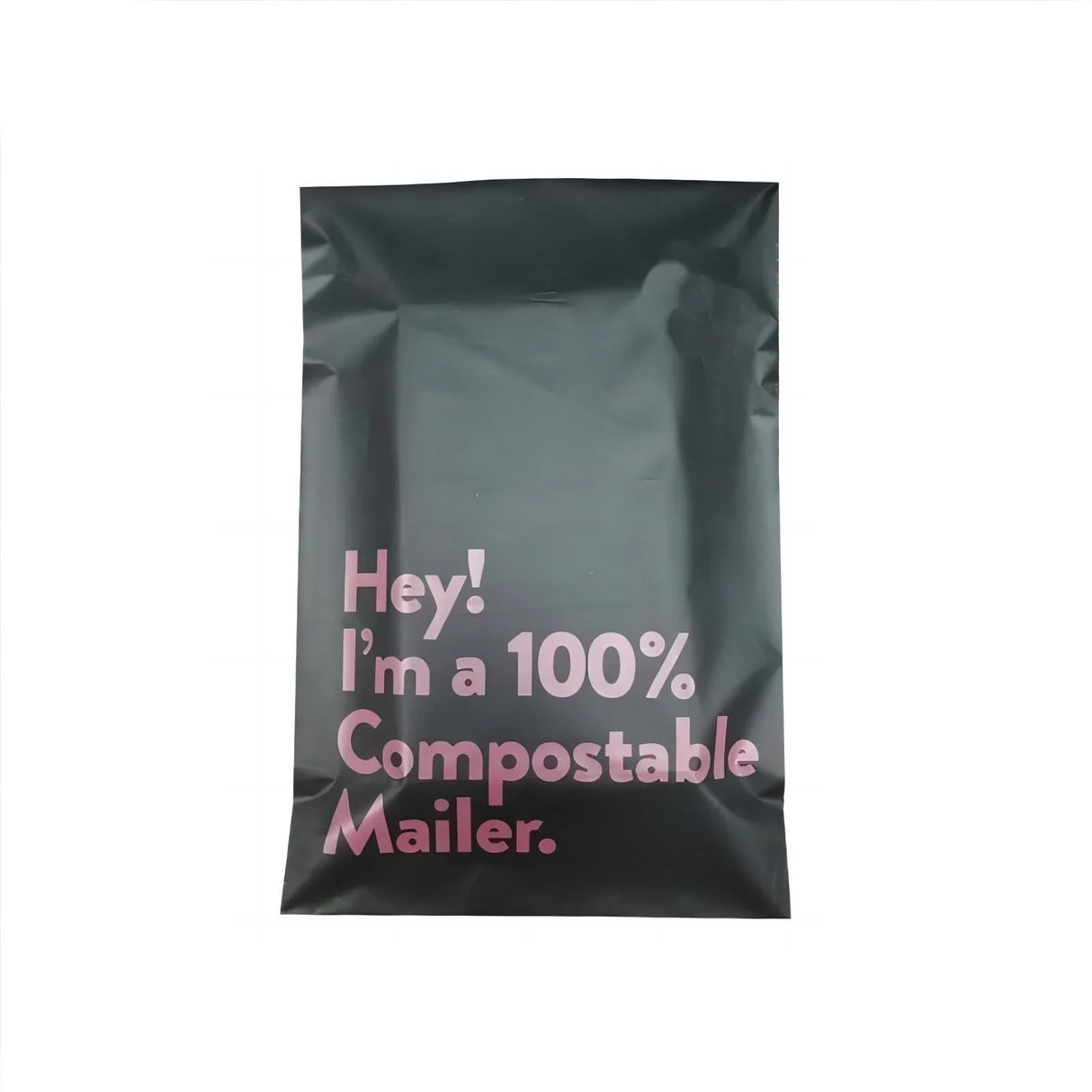 Black compostable mailer with pink text that reads 'Hey! I’m a 100% Compostable Mailer.'
