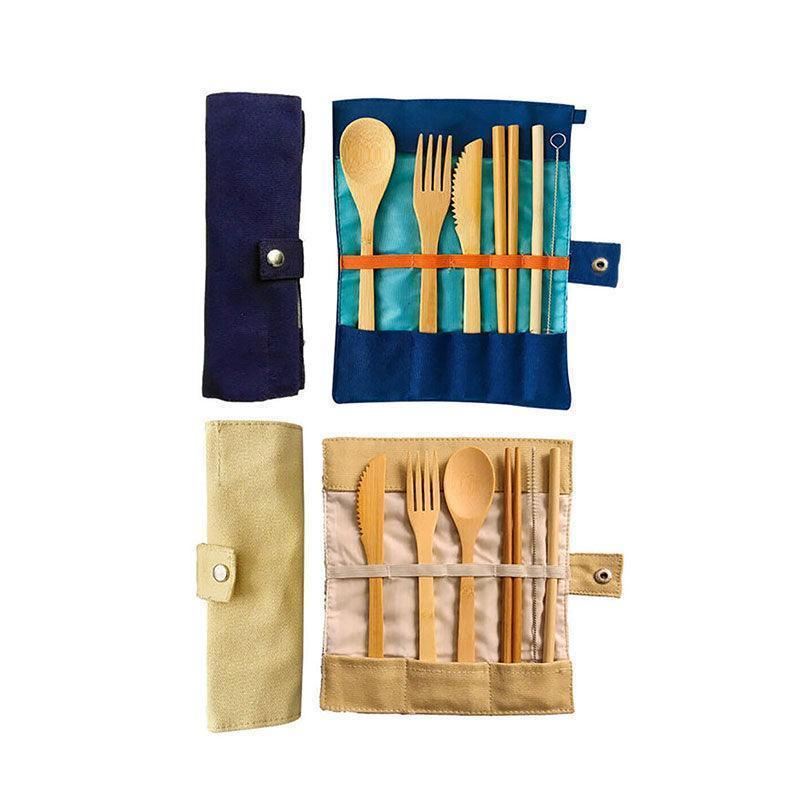 Bamboo cutlery set in a portable fabric case, featuring a spoon, fork, knife, chopsticks, and a cleaning brush