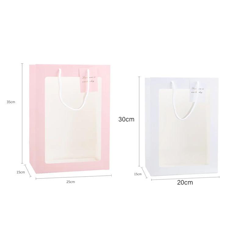 Set of stylish window paper bags with clear window and sturdy handles