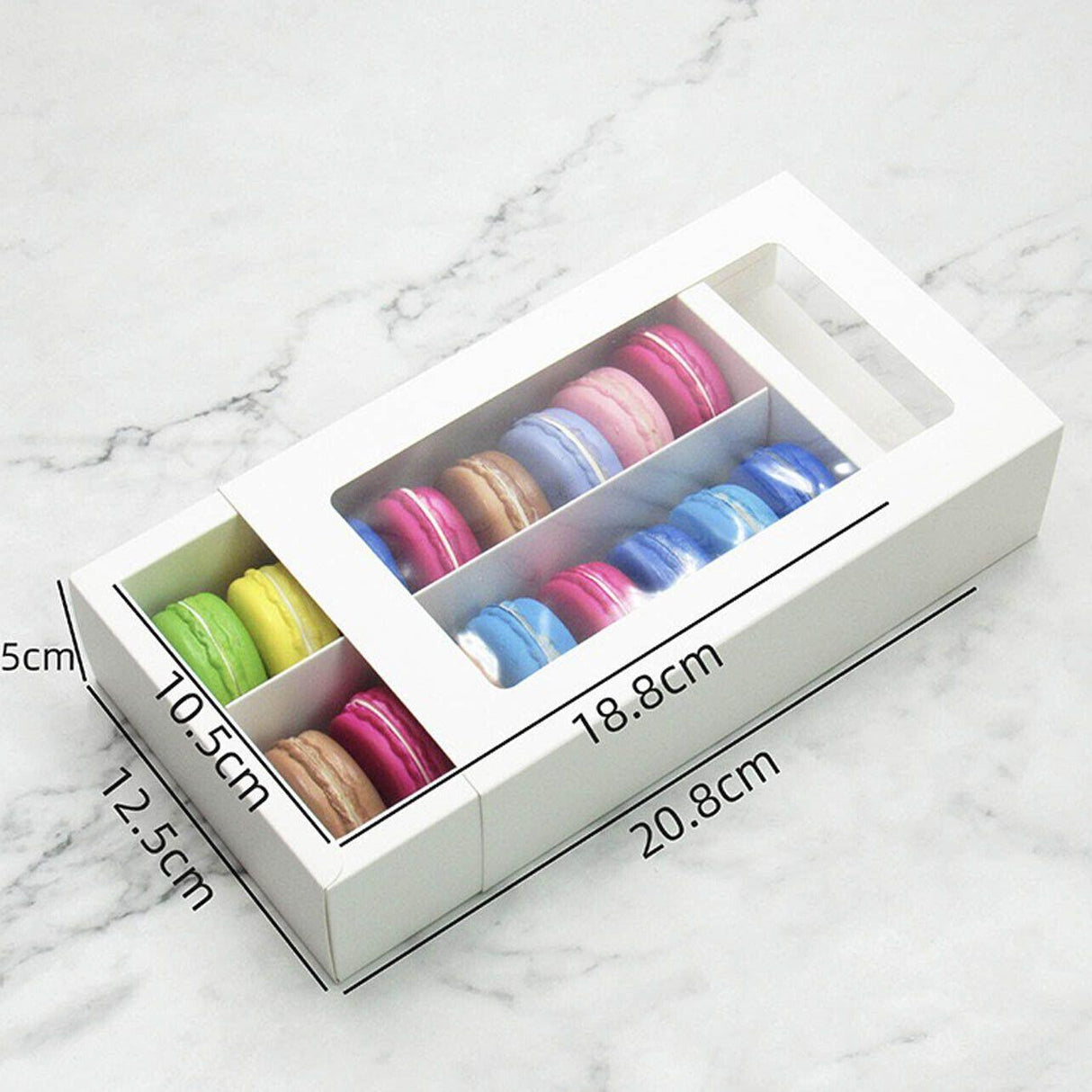 A beautifully arranged assortment of macarons displayed in our elegant macaron box