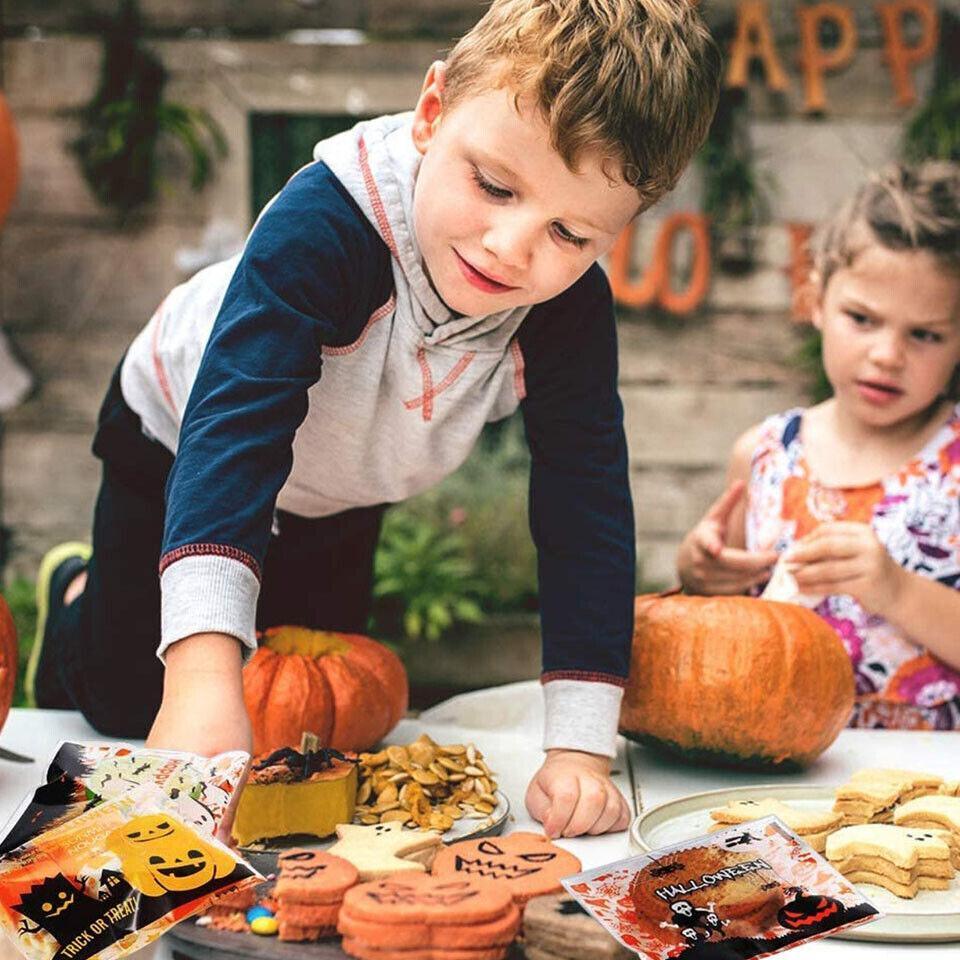 Child holding a festive Halloween Bag filled with candy