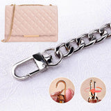 A chic handbag enhanced with a sleek and durable chain for bag strap, showcasing its elegant design.