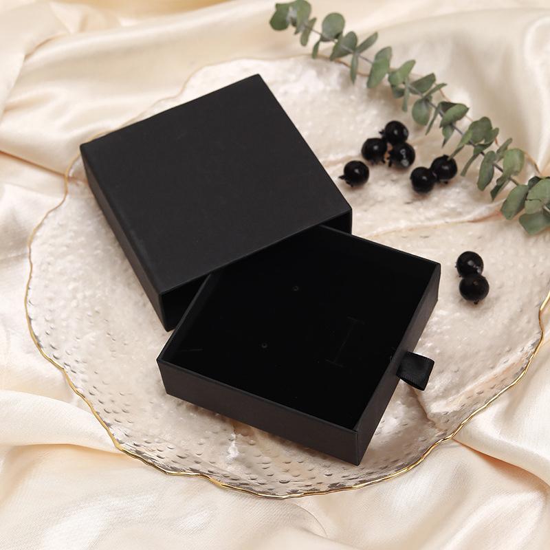 Elegant Jewelry Box Case open on a dresser with various jewelry compartments