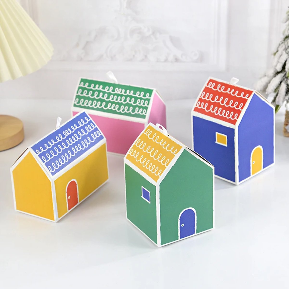 Add a touch of whimsy and colour to your next event with these charming small house gift boxes. 