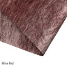 A selection of fabric sheets in various colors, including pink, white, brown, and blue.
