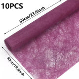 A selection of fabric sheets in various colors, including pink, white, brown, and blue.
