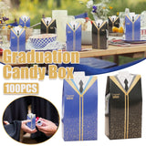 A collection of graduation-themed candy boxes arranged on a decorated table for a party.