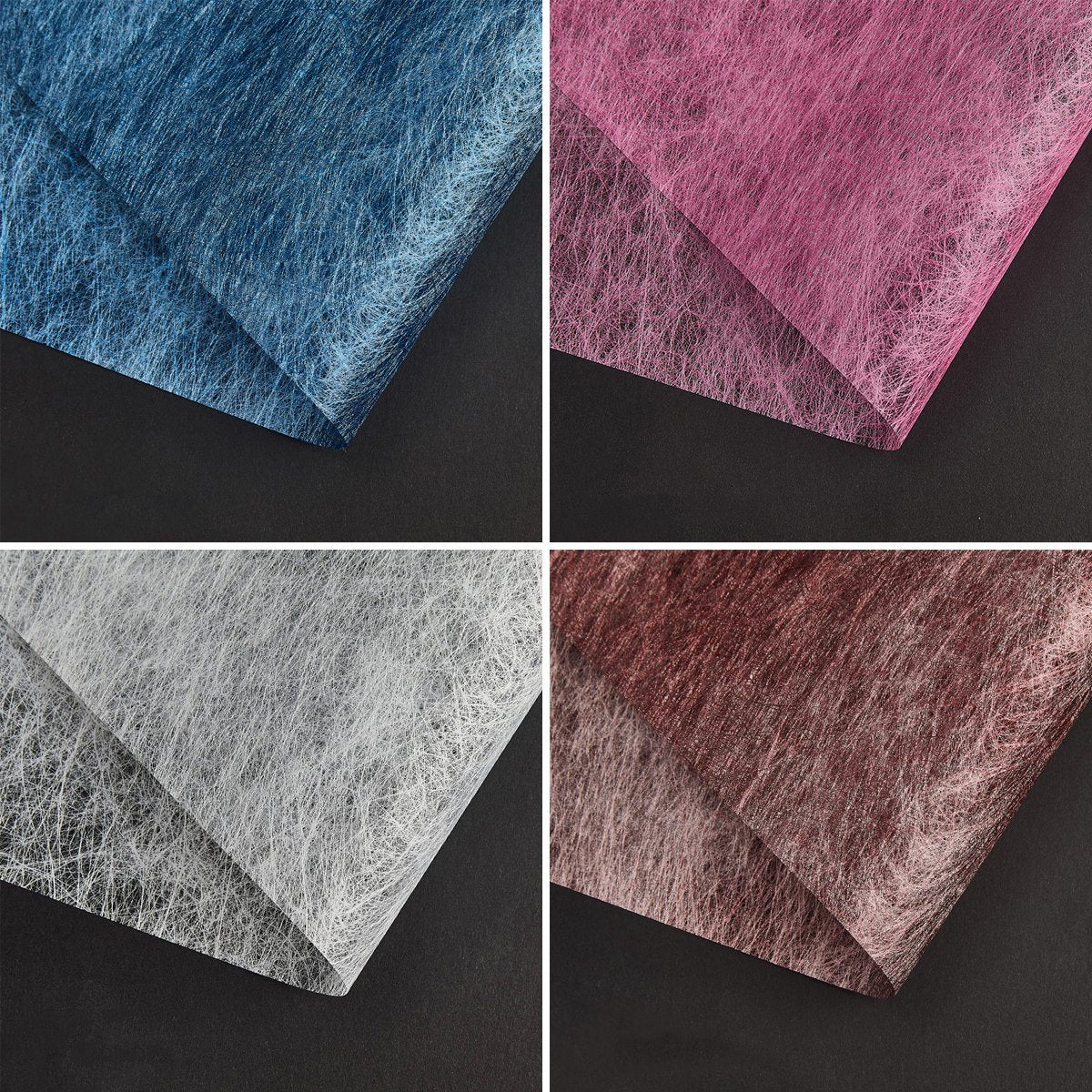 A selection of fabric sheets in various colors, including pink, white, brown, and blue.
