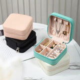 Compact and elegant travel jewelry case with multiple compartments