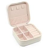 Compact and elegant travel jewelry case with multiple compartments