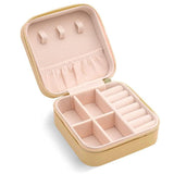 Compact and elegant travel jewelry case with multiple compartments