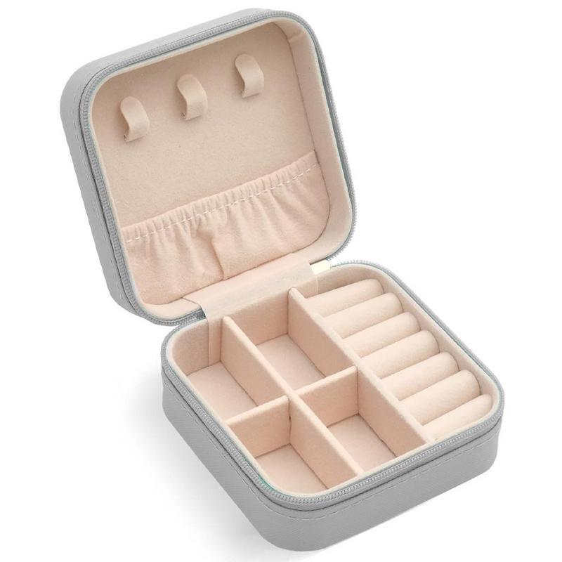 Compact and elegant travel jewelry case with multiple compartments