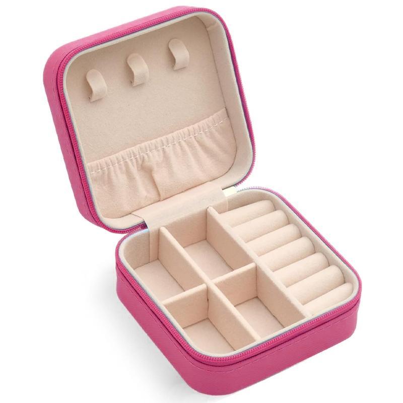 Compact and elegant travel jewelry case with multiple compartments