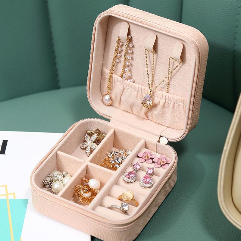 Compact and elegant travel jewelry case with multiple compartments