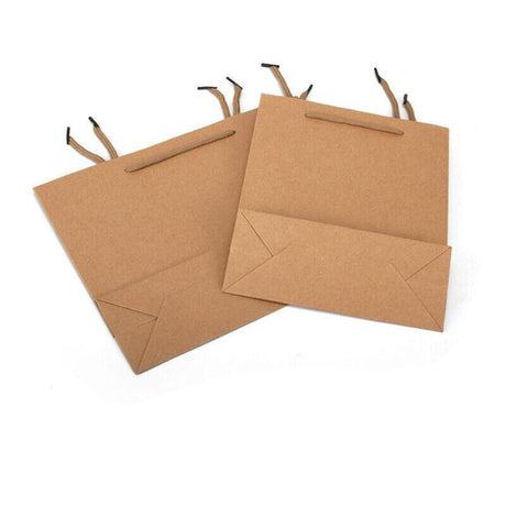 A collection of natural brown kraft paper bags with twisted paper handles, ready for versatile use.