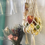 Elegant and spacious three-tier hanging fruit basket in a kitchen