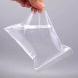 A variety of small items neatly organized in clear small ziplock pouches, showcasing their versatility and convenience.