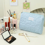 Stylish and compact travel makeup pouch with multiple compartments