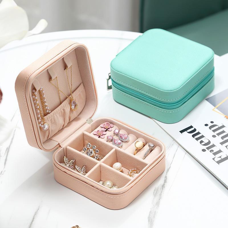 Compact and elegant travel jewelry case with multiple compartments