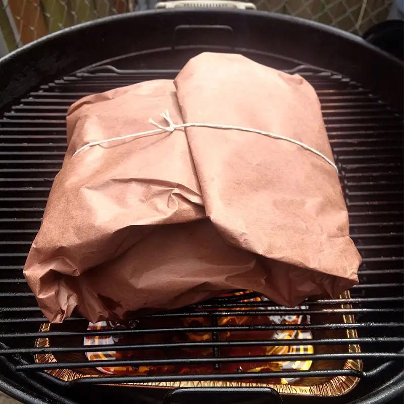 Butcher paper roll being dispensed in a kitchen setting