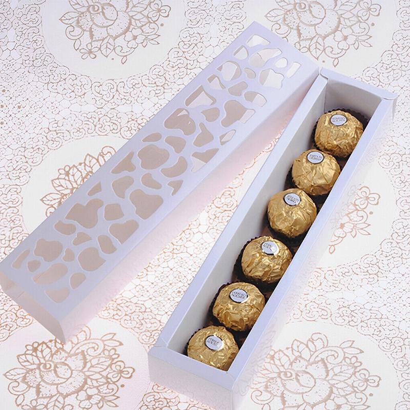 Beautifully arranged macarons in a Macaron Box with a clear viewing window.