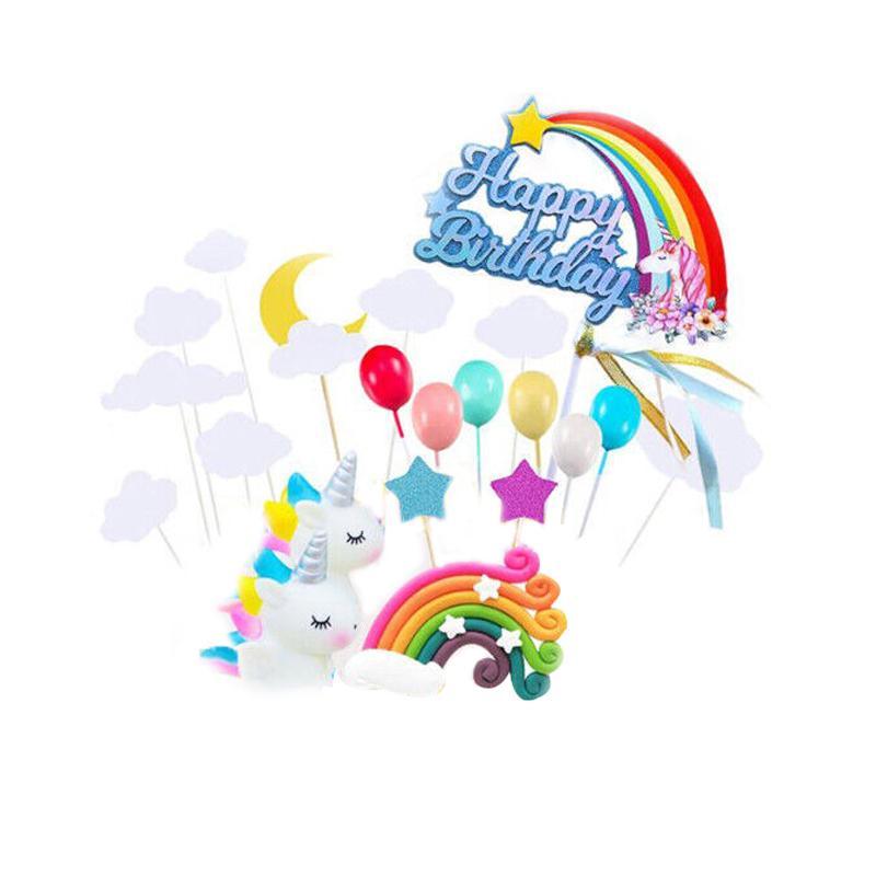 Whimsical unicorn cake topper with rainbow mane and golden horn